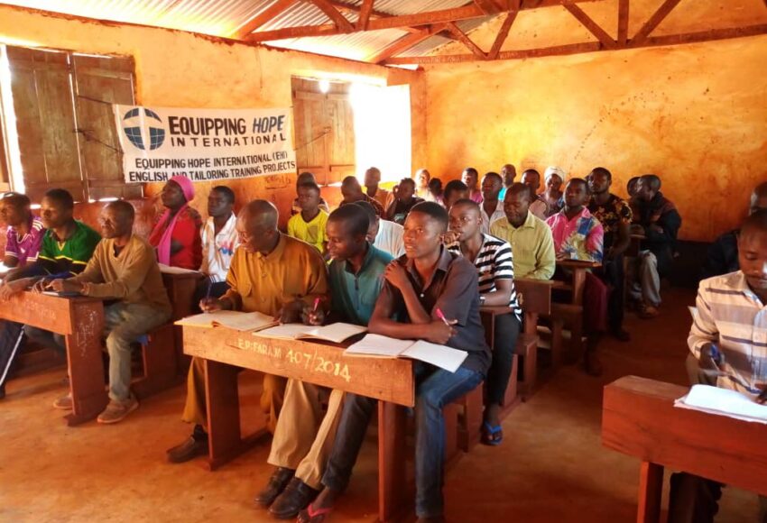 Congolese refugee students learning English at a Teaching Hope literacy class in Nyarugusu Refugee Camp in Tanzania