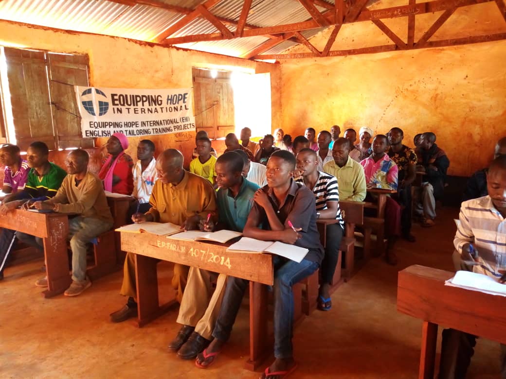 Congolese refugee students learning English at a Teaching Hope literacy class in Nyarugusu Refugee Camp in Tanzania