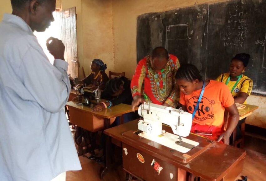 women learning to become tailors through tailoring apprenticeships with Equipping Hope's Business of Hope program in Nyarusgusu Refugee Camp in Tanzania.