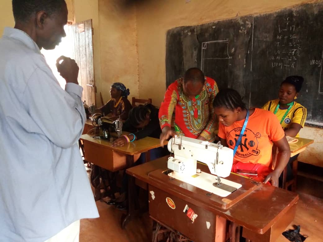women learning to become tailors through tailoring apprenticeships with Equipping Hope's Business of Hope program in Nyarusgusu Refugee Camp in Tanzania.