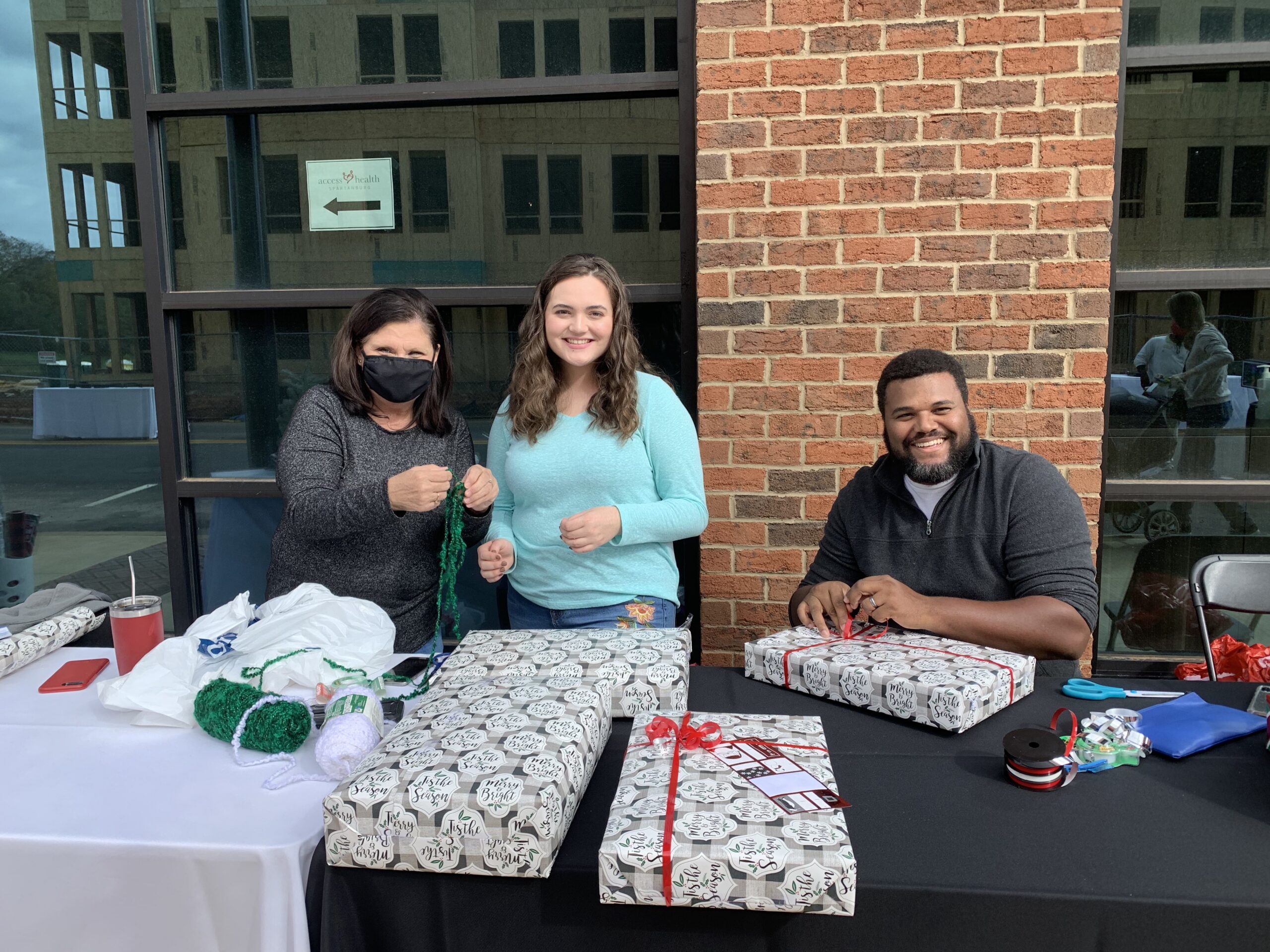 Cofounder Alex Harvey at a stateside gift wrapping fundraiser for Equipping Hope International